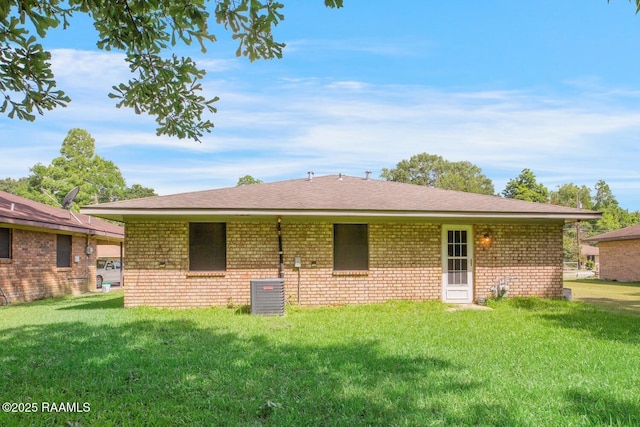 809 Cecile Blvd, Breaux Bridge, LA 70517 - rear view of house featuring brick siding, a lawn, and a shingled roof