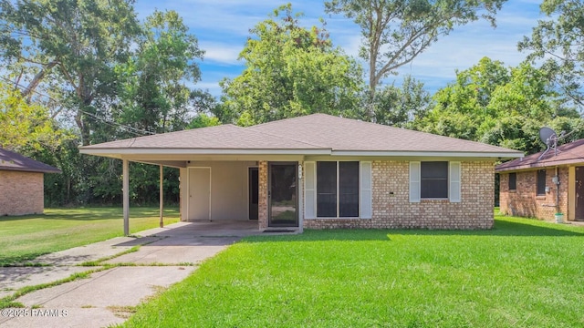 809 Cecile Blvd, Breaux Bridge, LA 70517 - view of front of property with concrete driveway, a front lawn, an attached carport, brick siding, and a shingled roof