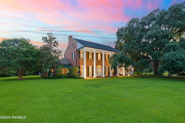 6302 Old Jeanerette Rd, New Iberia, LA 70563 - neoclassical home with a front yard and a chimney