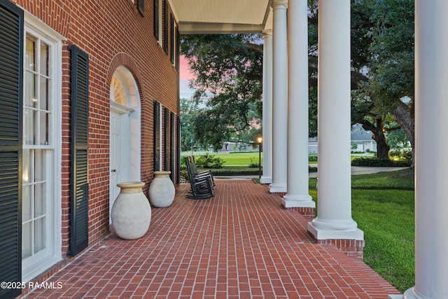 6302 Old Jeanerette Rd, New Iberia, LA 70563 - patio terrace at dusk with covered porch