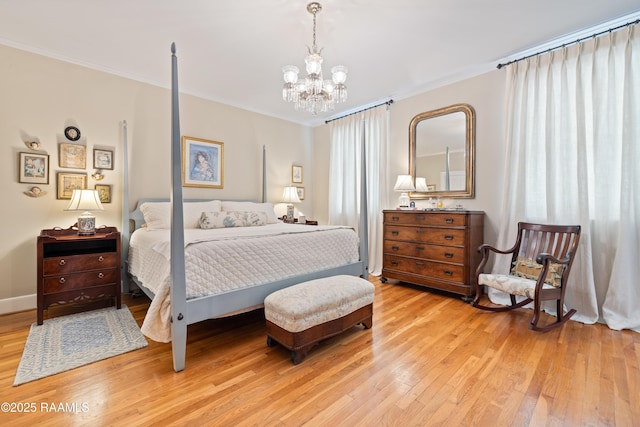 6302 Old Jeanerette Rd, New Iberia, LA 70563 - bedroom featuring light wood-style flooring, crown molding, and a chandelier