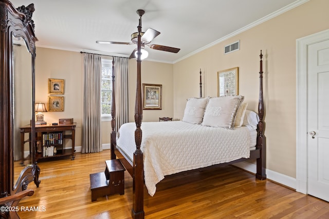 6302 Old Jeanerette Rd, New Iberia, LA 70563 - bedroom with light wood-style floors, ornamental molding, and a ceiling fan