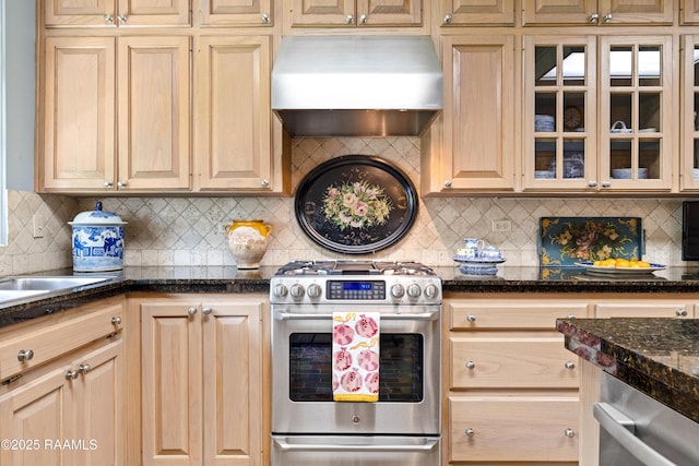 6302 Old Jeanerette Rd, New Iberia, LA 70563 - kitchen with stainless steel appliances, wall chimney exhaust hood, decorative backsplash, and glass insert cabinets