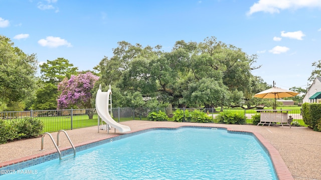 6302 Old Jeanerette Rd, New Iberia, LA 70563 - view of pool with a water slide, a patio area, and view of scattered trees