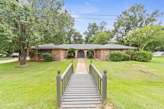 118 Garrigue Dr, Opelousas, LA 70570 - single story home featuring brick siding and a front yard