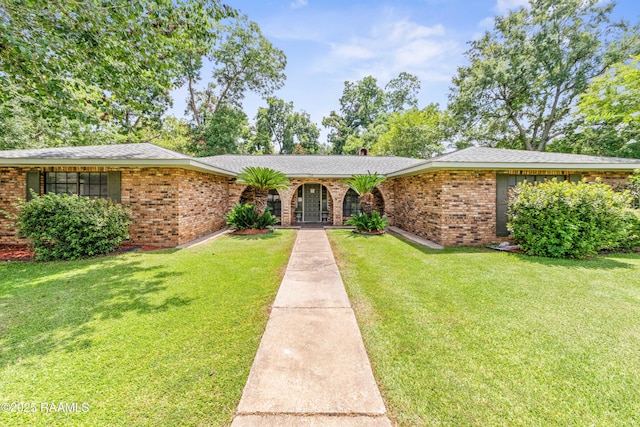 118 Garrigue Dr, Opelousas, LA 70570 - ranch-style home featuring a front lawn and brick siding