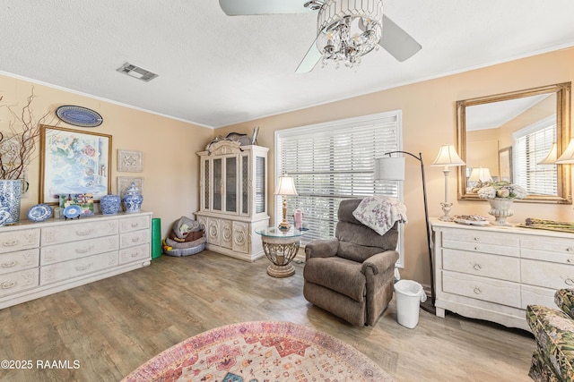 118 Garrigue Dr, Opelousas, LA 70570 - sitting room with ceiling fan, wood finished floors, and ornamental molding