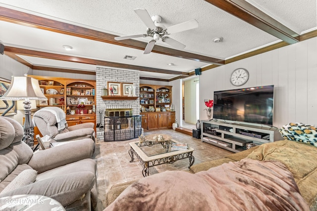 118 Garrigue Dr, Opelousas, LA 70570 - living area with beam ceiling, crown molding, a textured ceiling, a ceiling fan, and a fireplace