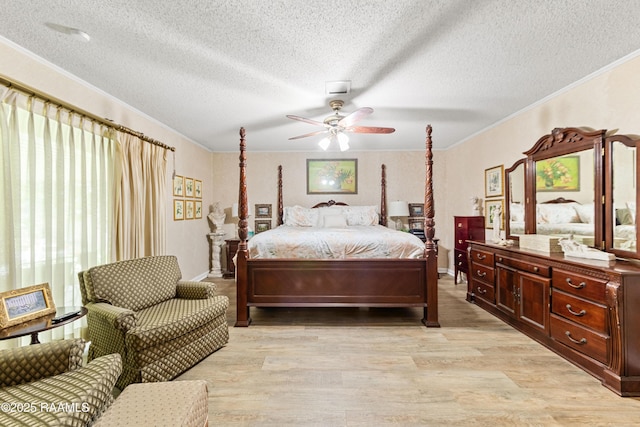 118 Garrigue Dr, Opelousas, LA 70570 - bedroom with crown molding, light wood-style flooring, a textured ceiling, and ceiling fan