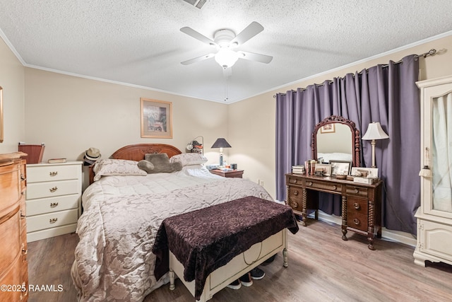 118 Garrigue Dr, Opelousas, LA 70570 - bedroom with wood finished floors, crown molding, a textured ceiling, and ceiling fan