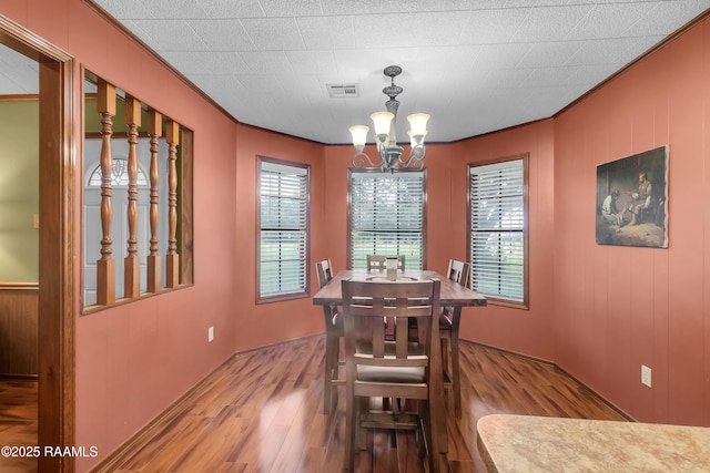 307 Bertrand Rd, Opelousas, LA 70570 - dining room with crown molding, wood finished floors, and a chandelier