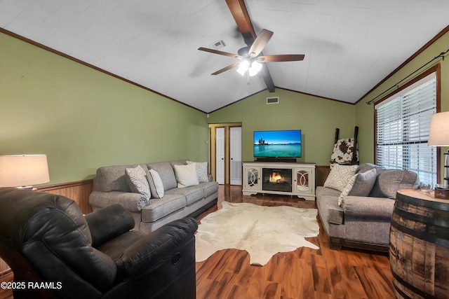 307 Bertrand Rd, Opelousas, LA 70570 - living room with wood finished floors, a ceiling fan, and wainscoting