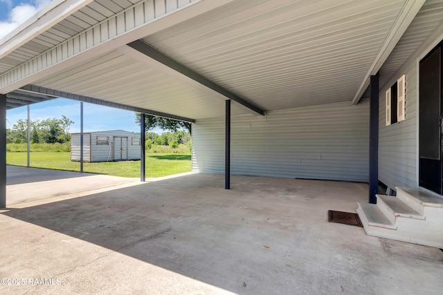 307 Bertrand Rd, Opelousas, LA 70570 - view of patio / terrace featuring a storage shed and a carport