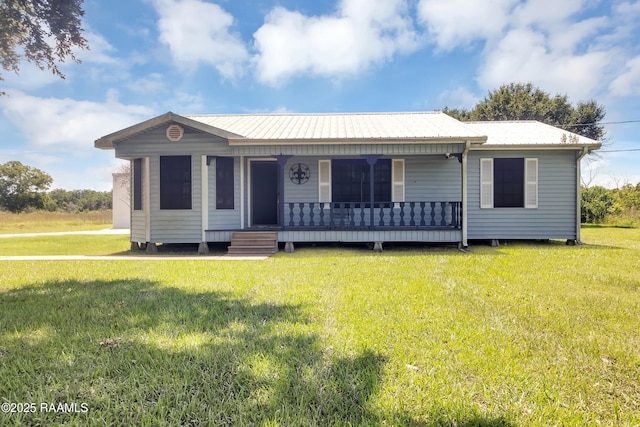 307 Bertrand Rd, Opelousas, LA 70570 - view of front facade with a front yard, a porch, and a metal roof