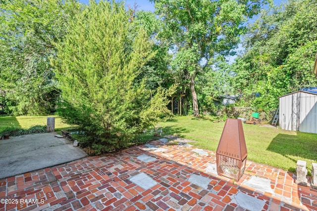 1912 Mimosa St, Abbeville, LA 70510 - view of patio / terrace with a storage shed