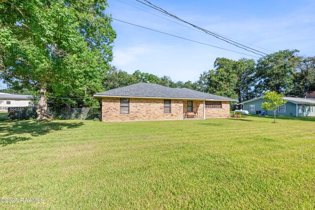 1912 Mimosa St, Abbeville, LA 70510 - back of house featuring brick siding