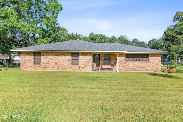 1912 Mimosa St, Abbeville, LA 70510 - single story home with brick siding, a patio, and roof with shingles