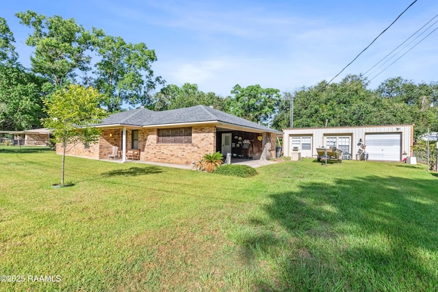 1912 Mimosa St, Abbeville, LA 70510 - back of property featuring a garage, a lawn, and brick siding