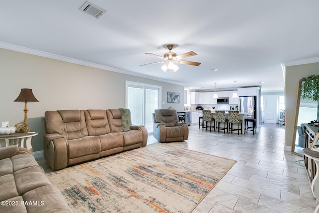 101 Barrow St, New Iberia, LA 70563 - living room featuring crown molding and ceiling fan