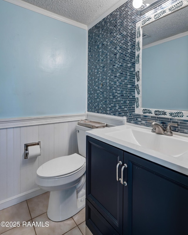 26 Morning Glory Sq, Lafayette, LA 70507 - bathroom with a textured ceiling, wainscoting, crown molding, tile patterned flooring, and vanity