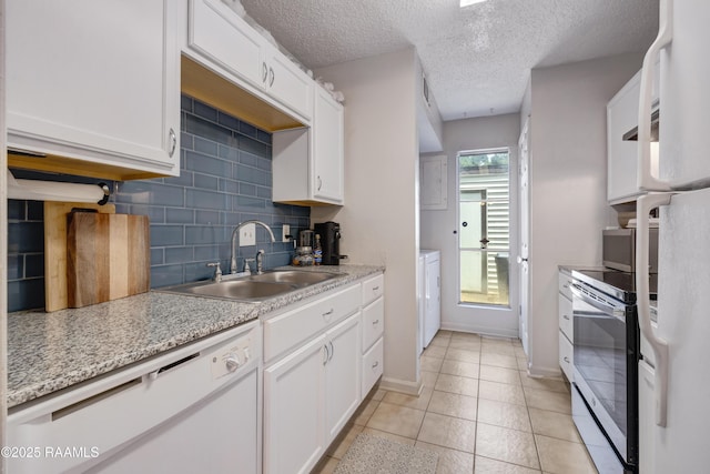 26 Morning Glory Sq, Lafayette, LA 70507 - kitchen with white appliances, tasteful backsplash, white cabinets, a textured ceiling, and light tile patterned flooring