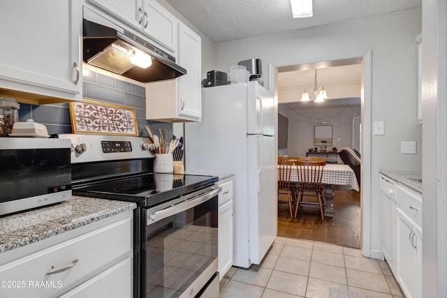 26 Morning Glory Sq, Lafayette, LA 70507 - kitchen featuring stainless steel appliances, under cabinet range hood, white cabinetry, a chandelier, and light tile patterned flooring