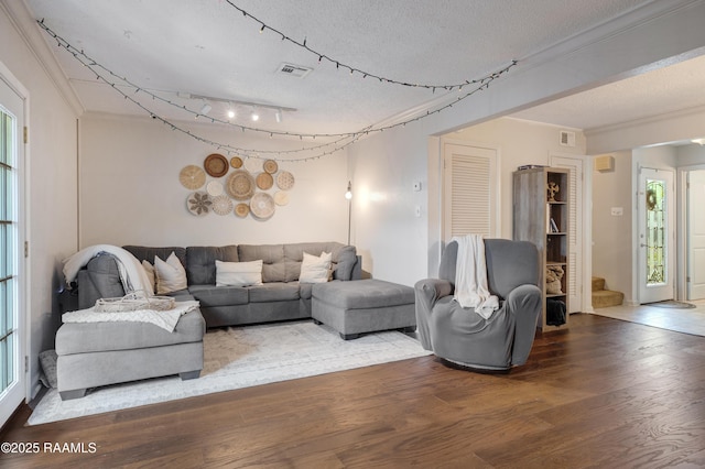 26 Morning Glory Sq, Lafayette, LA 70507 - living room with a textured ceiling, wood finished floors, and ornamental molding