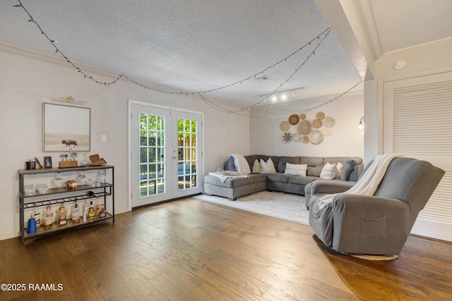 26 Morning Glory Sq, Lafayette, LA 70507 - living room featuring a textured ceiling, wood finished floors, and french doors