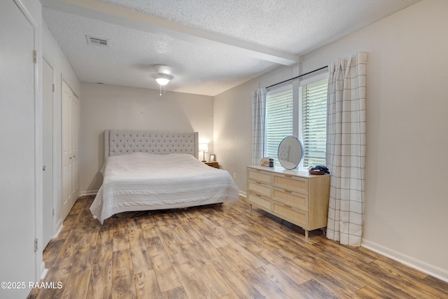 26 Morning Glory Sq, Lafayette, LA 70507 - bedroom with a textured ceiling, wood finished floors, and a ceiling fan