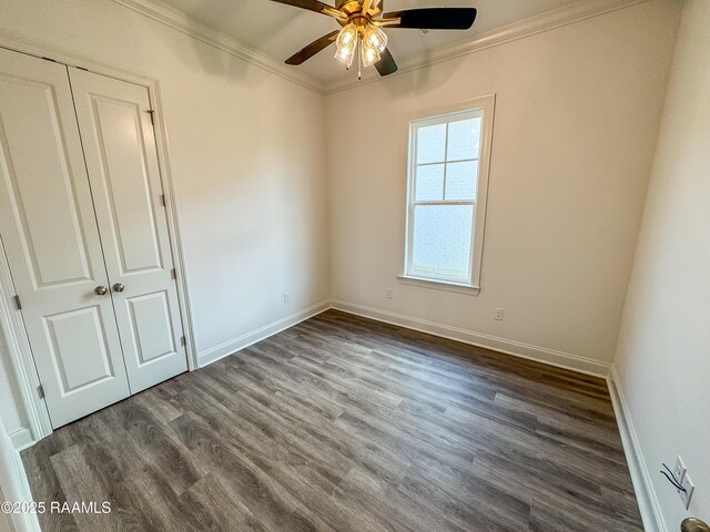 224 Trail Pointe Dr, Scott, LA 70583 - unfurnished bedroom with crown molding, dark wood-style flooring, a ceiling fan, and a closet