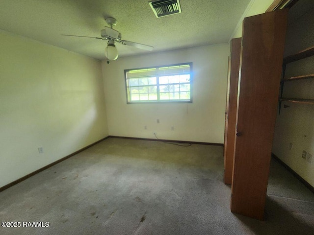 4702 Daspit Rd, New Iberia, LA 70563 - unfurnished bedroom featuring carpet, ceiling fan, and a textured ceiling