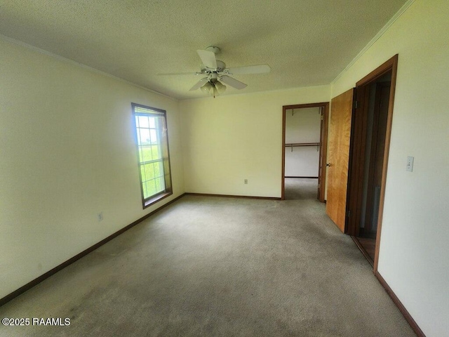 4702 Daspit Rd, New Iberia, LA 70563 - unfurnished bedroom featuring carpet, a textured ceiling, crown molding, and a ceiling fan
