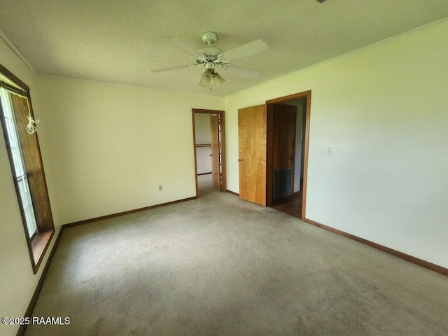 4702 Daspit Rd, New Iberia, LA 70563 - unfurnished room featuring carpet flooring, a ceiling fan, and crown molding