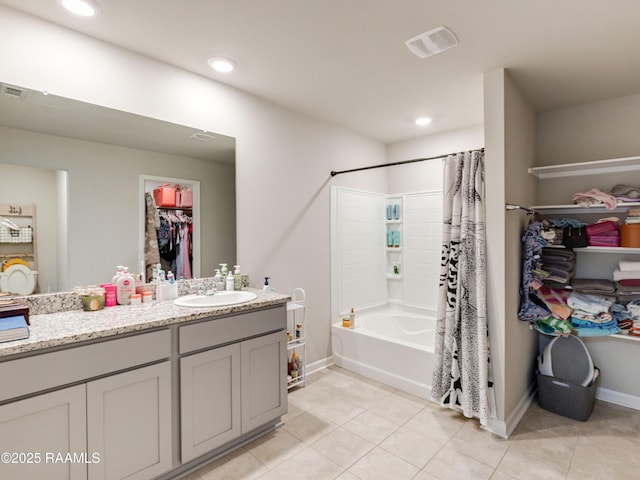 107 Southern Oak Dr, Lafayette, LA 70507 - bathroom featuring vanity, a walk in closet, shower / bathtub combination with curtain, tile patterned flooring, and recessed lighting