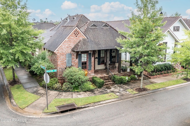 104 Littleton Xing, Lafayette, LA 70508 - view of front facade with brick siding and a porch