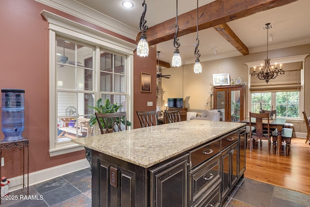 104 Littleton Xing, Lafayette, LA 70508 - kitchen featuring stone tile flooring, light stone counters, a chandelier, decorative light fixtures, and beam ceiling
