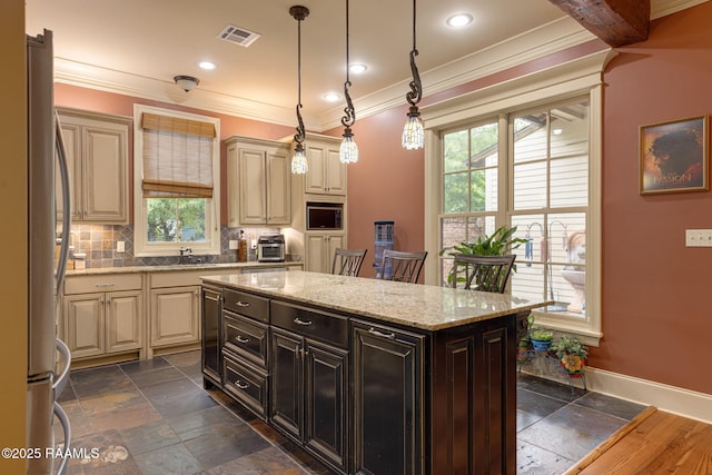 104 Littleton Xing, Lafayette, LA 70508 - kitchen featuring stainless steel appliances, plenty of natural light, stone tile floors, crown molding, and recessed lighting