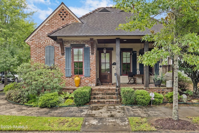 104 Littleton Xing, Lafayette, LA 70508 - view of front of property featuring a porch, brick siding, and a shingled roof