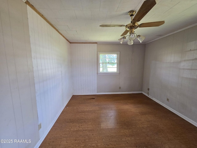 110 Judge Dr, Lafayette, LA 70507 - unfurnished room with wood finished floors, crown molding, ceiling fan, and wood walls