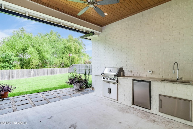 604 Channel Dr, Broussard, LA 70518 - fenced backyard featuring exterior kitchen, a ceiling fan, and a patio area
