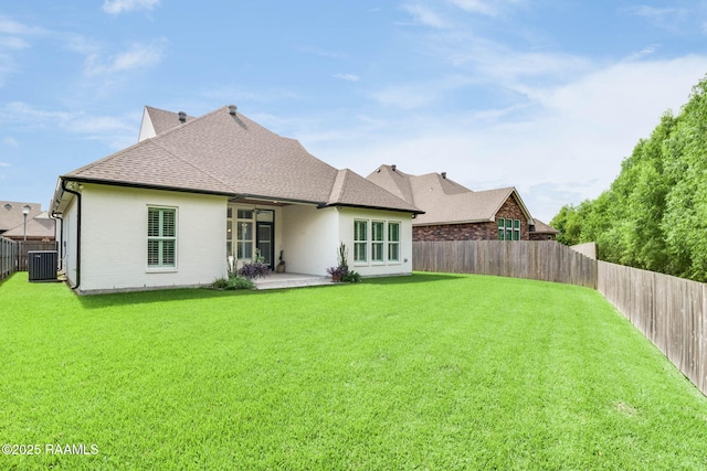 604 Channel Dr, Broussard, LA 70518 - back of property with a fenced backyard, roof with shingles, a patio area, and stucco siding