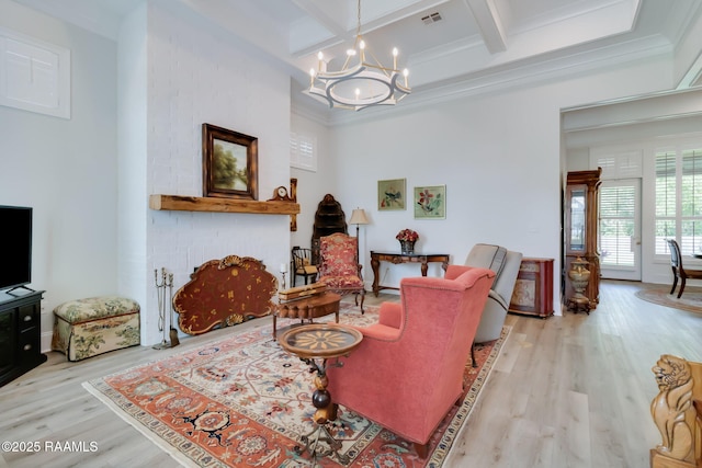 604 Channel Dr, Broussard, LA 70518 - sitting room with coffered ceiling, a chandelier, wood finished floors, beamed ceiling, and a fireplace