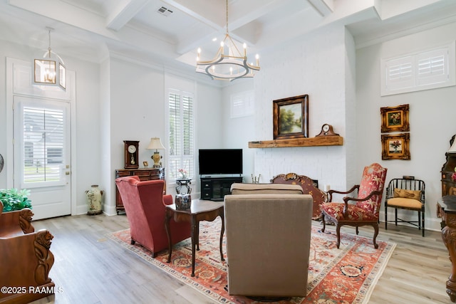 604 Channel Dr, Broussard, LA 70518 - living room with wood finished floors, a chandelier, beamed ceiling, coffered ceiling, and crown molding