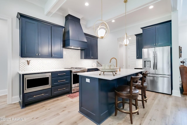 604 Channel Dr, Broussard, LA 70518 - kitchen featuring appliances with stainless steel finishes, custom exhaust hood, decorative backsplash, light wood-style floors, and light countertops