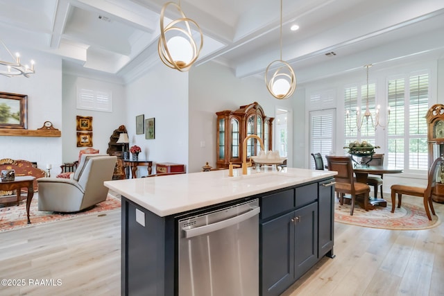 604 Channel Dr, Broussard, LA 70518 - kitchen featuring stainless steel dishwasher, light wood-style flooring, beam ceiling, light countertops, and hanging light fixtures