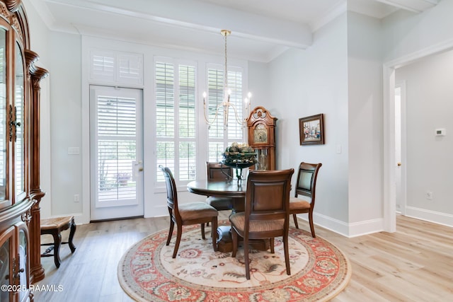 604 Channel Dr, Broussard, LA 70518 - dining room featuring a chandelier, light wood-type flooring, and ornamental molding