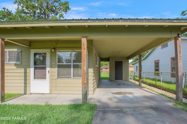 204 Doc Duhon St, Lafayette, LA 70501 - view of car parking featuring an attached carport and driveway