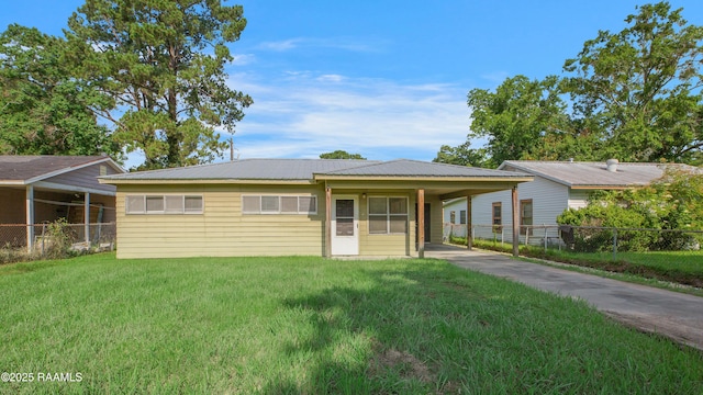 204 Doc Duhon St, Lafayette, LA 70501 - single story home with asphalt driveway, a carport, and a metal roof