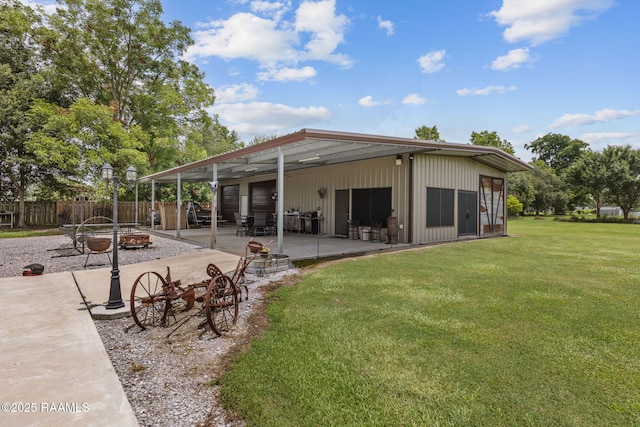 1054 Preston Broussard Rd, Arnaudville, LA 70512 - back of house with an outdoor fire pit and a patio area