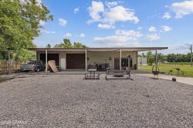 1054 Preston Broussard Rd, Arnaudville, LA 70512 - rear view of property with gravel driveway and an outdoor structure